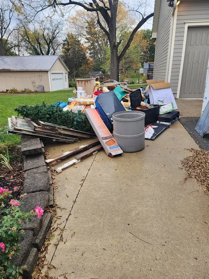 Dumpster being loaded with debris for 10 Yard Dumpster Rental in Magna